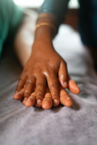 One hand massaging the other hand